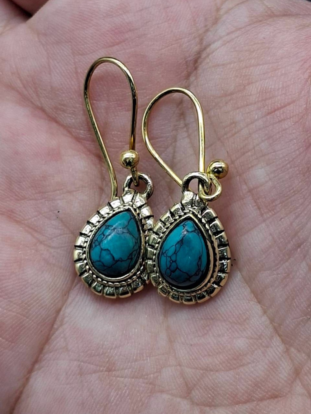 Boho Style Earrings Feature Teardrop Shaped Turquoise Gemstones Set In Gold Tone